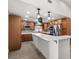 Spacious kitchen with stainless steel appliances, a large center island, and custom cabinets, offering ample storage at 2426 Abbey Ave, Orlando, FL 32833