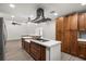 Well-equipped kitchen with stainless steel appliances, a center island, and custom cabinetry, designed for functionality at 2426 Abbey Ave, Orlando, FL 32833