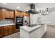 Modern kitchen with stainless steel appliances, center island, and sleek countertops, great for culinary enthusiasts at 2426 Abbey Ave, Orlando, FL 32833