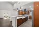 Bright kitchen with stainless steel appliances, center island, and modern finishes, perfect for cooking and entertaining at 2426 Abbey Ave, Orlando, FL 32833