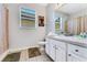 Clean bathroom featuring a vanity with white cabinets and a shower/tub combination at 2609 Dinville St, Kissimmee, FL 34747