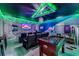 Amazing home theater and game room with surround sound, game tables, and vibrant custom lighting at 2609 Dinville St, Kissimmee, FL 34747