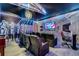 Fully equipped game room with theater seating, surround sound, a large flat screen TV, and custom lighting at 2609 Dinville St, Kissimmee, FL 34747