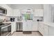 Modern kitchen featuring stainless steel appliances and quartz countertops at 2609 Dinville St, Kissimmee, FL 34747
