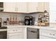 Bright kitchen featuring white cabinets, stainless steel appliances and countertop beverage station at 2609 Dinville St, Kissimmee, FL 34747