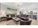 Open-concept living room flows into kitchen, with comfortable seating and natural light at 2609 Dinville St, Kissimmee, FL 34747
