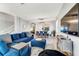 This spacious living room includes an adjacent dining area and features a comfortable navy couch at 2609 Dinville St, Kissimmee, FL 34747