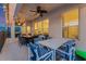 Outdoor patio featuring multiple dining areas, ceiling fans and access to a pool at 2609 Dinville St, Kissimmee, FL 34747