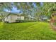 Home exterior with manicured lawn and lush landscaping at 288 Englenook Dr, Debary, FL 32713