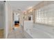 The bathroom features double sinks, a large soaking tub, and natural lighting at 288 Englenook Dr, Debary, FL 32713