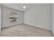 Bedroom with neutral carpet, ceiling fan, and a window at 288 Englenook Dr, Debary, FL 32713