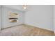 A simple bedroom features carpet, a ceiling fan, and a window at 288 Englenook Dr, Debary, FL 32713