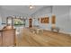 Spacious living room featuring high ceilings, hardwood floors, and access to outdoor patio at 288 Englenook Dr, Debary, FL 32713