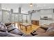 Inviting living room with vaulted ceilings, hardwood floors, a dining area and comfortable leather seating at 288 Englenook Dr, Debary, FL 32713