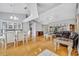 Open-concept living room with hardwood floors, high ceilings, and stylish furnishings at 288 Englenook Dr, Debary, FL 32713