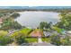 Beautiful lakefront home with mature trees, a large yard, and a private dock for waterfront enjoyment at 3108 Troy Dr, Orlando, FL 32806