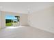 Bedroom features sliding glass doors to the patio, and white walls and tile floors at 3108 Troy Dr, Orlando, FL 32806