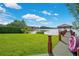 Stunning backyard featuring a sprawling lawn, waterfront views, private dock and gazebo, with lush landscaping at 3108 Troy Dr, Orlando, FL 32806