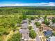An aerial view shows a residential neighborhood near wooded areas at 3120 Ginger Cir, Orlando, FL 32826