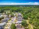 An aerial view of the neighborhood showcases houses, streets, and green spaces at 3120 Ginger Cir, Orlando, FL 32826