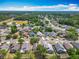 An aerial view highlights the neighborhood with a pond nearby, showcasing community living at 3120 Ginger Cir, Orlando, FL 32826