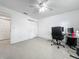Open bedroom with tile flooring, ceiling fan, and generous space, well lit from the window and ceiling fan at 3120 Ginger Cir, Orlando, FL 32826
