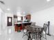 Open-concept living and dining area connected to the kitchen with tile flooring and updated features at 3120 Ginger Cir, Orlando, FL 32826