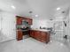 Open-concept kitchen and dining area with modern appliances and an adjacent living room area at 3120 Ginger Cir, Orlando, FL 32826