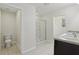 Well-lit bathroom featuring a walk-in shower and double vanity sink at 3443 Berkshire Woods Ter, Deltona, FL 32725