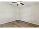Well-lit bedroom with hardwood floors and a ceiling fan at 3443 Berkshire Woods Ter, Deltona, FL 32725