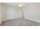 Clean bedroom features soft carpeting, neutral walls, and a large closet, creating a cozy and inviting space at 3443 Berkshire Woods Ter, Deltona, FL 32725