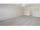 Large bedroom featuring soft, neutral carpeting and ample natural light at 3443 Berkshire Woods Ter, Deltona, FL 32725
