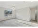 A spacious bedroom with neutral walls, plush carpeting, and a bright window at 3443 Berkshire Woods Ter, Deltona, FL 32725