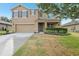 Charming two-story home featuring a two-car garage, neutral paint, manicured landscaping, and a welcoming front porch at 3443 Berkshire Woods Ter, Deltona, FL 32725