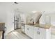Bright kitchen featuring granite countertops, stainless steel appliances, and a central island with bar seating at 3443 Berkshire Woods Ter, Deltona, FL 32725