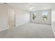 A large main bedroom featuring neutral walls, plush carpeting, and bright windows at 3443 Berkshire Woods Ter, Deltona, FL 32725