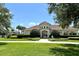 Charming clubhouse featuring a tile roof, landscaped grounds, and a welcoming entrance, perfect for community gatherings at 3579 Maple Ridge Loop, Kissimmee, FL 34741