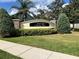 Entrance to the Forest Edge/Windsor Point community, featuring lush landscaping and a decorative sign at 3579 Maple Ridge Loop, Kissimmee, FL 34741