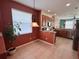 Cozy dining area with tile flooring, large window, and stylish lighting fixture at 3579 Maple Ridge Loop, Kissimmee, FL 34741