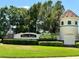 A well-manicured entrance sign to the Weston Reserve community is surrounded by lush greenery and mature trees at 3579 Maple Ridge Loop, Kissimmee, FL 34741