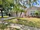 Charming home with a two-car garage, well-manicured lawn, and tasteful landscaping at 3579 Maple Ridge Loop, Kissimmee, FL 34741