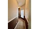Hallway with tile flooring, neutral wall paint, and natural lighting at 3579 Maple Ridge Loop, Kissimmee, FL 34741