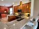 Modern kitchen featuring stainless steel appliances, granite countertops, and a breakfast bar with seating at 3579 Maple Ridge Loop, Kissimmee, FL 34741