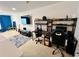 Spacious living area with neutral carpet, tv, and gaming setups, perfect for entertainment at 3579 Maple Ridge Loop, Kissimmee, FL 34741