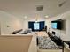 Spacious room with open layout, carpeting, and a variety of furniture and equipment at 3579 Maple Ridge Loop, Kissimmee, FL 34741