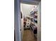 Walk-in pantry featuring wire shelving, tile flooring, and ample storage space at 3579 Maple Ridge Loop, Kissimmee, FL 34741