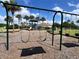 Swings at the playground offer a fun spot for to enjoy the outdoors, with views of the community at 3579 Maple Ridge Loop, Kissimmee, FL 34741
