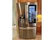 Stainless steel refrigerator with beverage dispenser and see-through glass door at 3579 Maple Ridge Loop, Kissimmee, FL 34741
