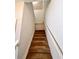 Staircase with carpeted steps, white risers, and a white handrail leading to the next level at 3579 Maple Ridge Loop, Kissimmee, FL 34741