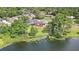 Beautiful waterfront home with mature landscaping, large yard and spacious deck, perfect for relaxing and entertaining at 40 W Laurel St, Apopka, FL 32703